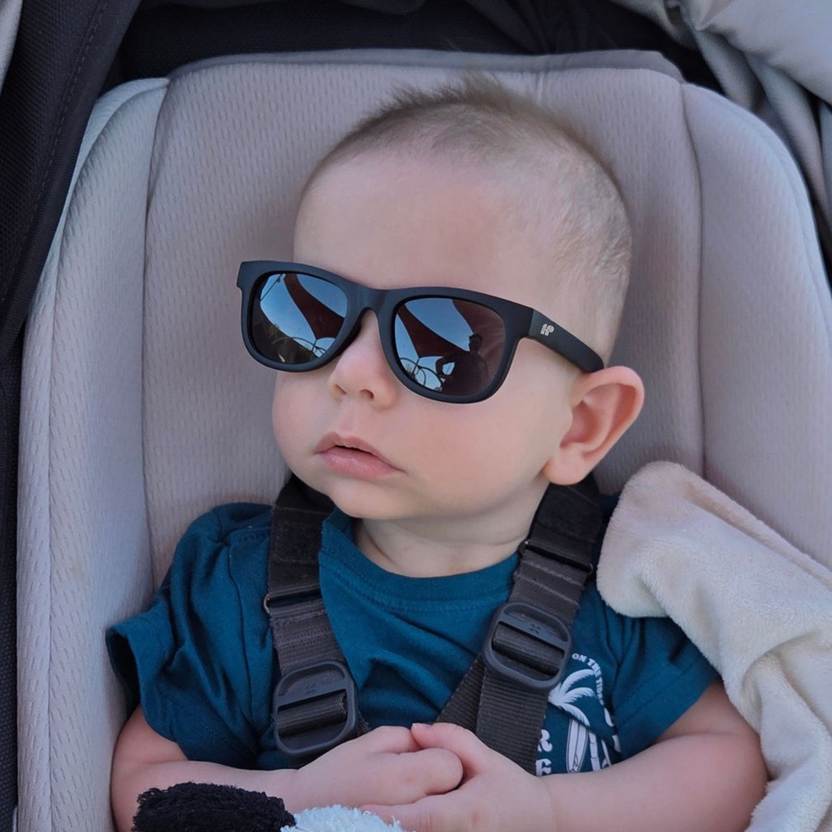 Baby in pram with black Hey Peeps sunglasses