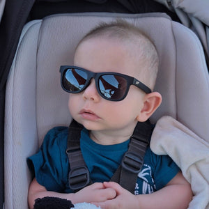 Baby in pram with black Hey Peeps sunglasses