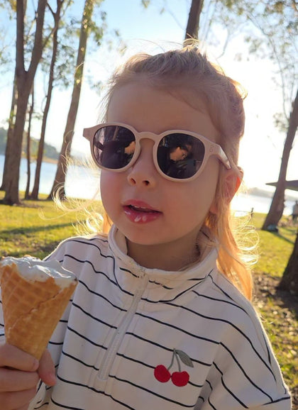 A child wearing Hey Peeps City Slickers sunglasses in Light Dusty Pink