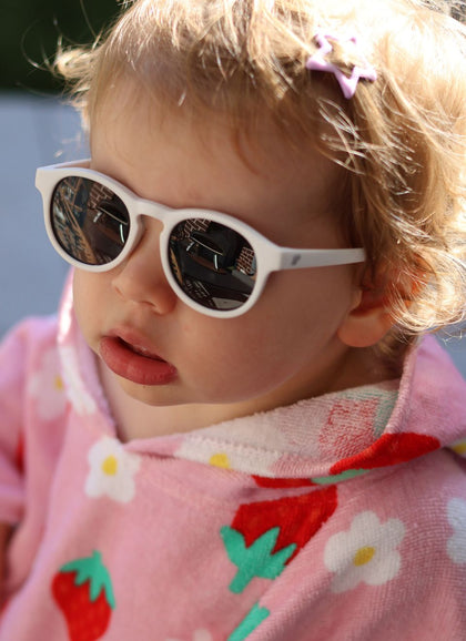 A child wearing Hey Peeps  sunglasses in White